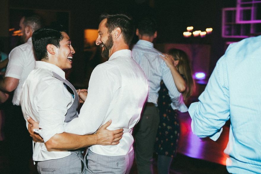 Two happy men looking at each other 