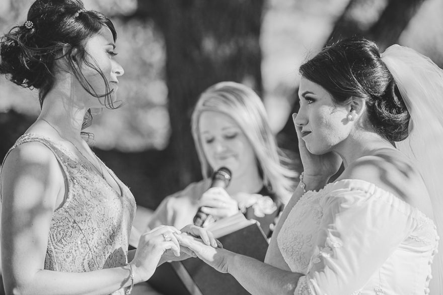 Two women holding hands and crying 