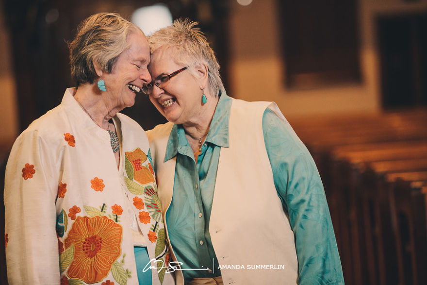 Two happy woman hugging and smiling 