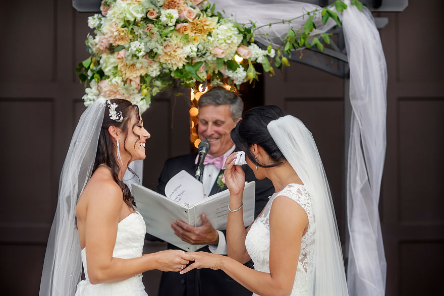 Two women holding hands and crying 