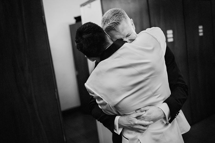 Two men hugging 