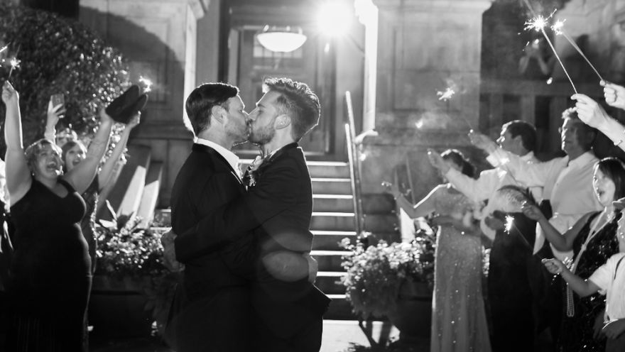 Two men kissing 
