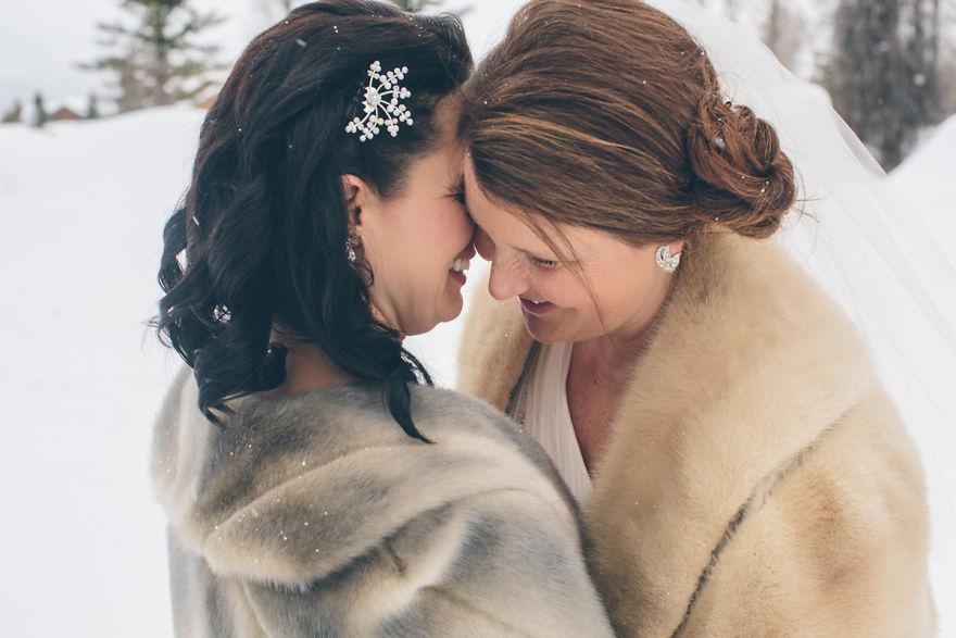 Two women hugging and laughing 