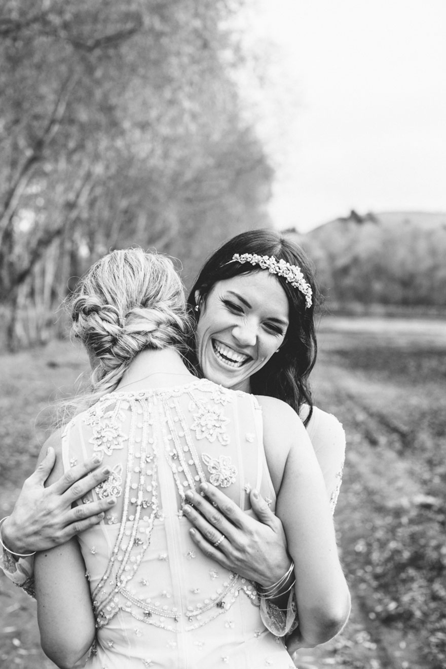 Two happy women hugging 