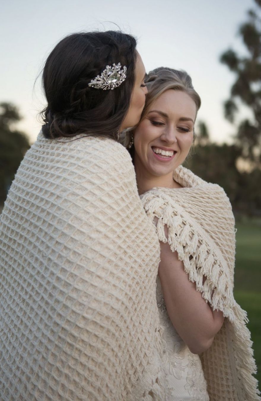 Two women kissing and hugging 