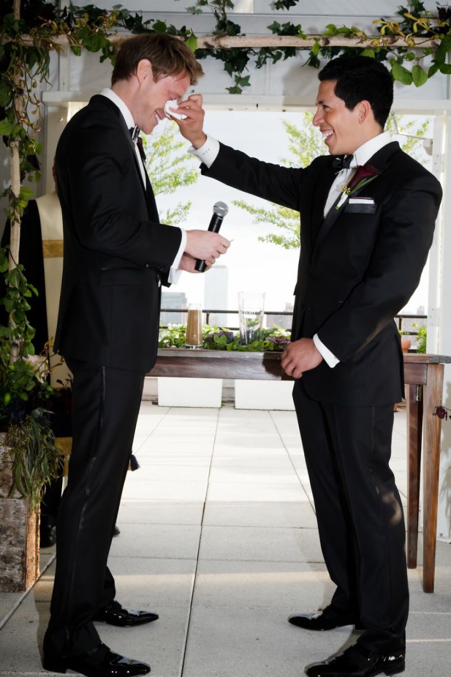 Man cleaning eyes for another man 