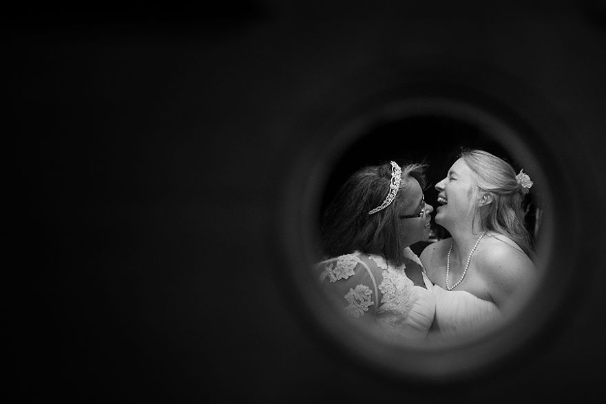 Two women laughing and hugging 