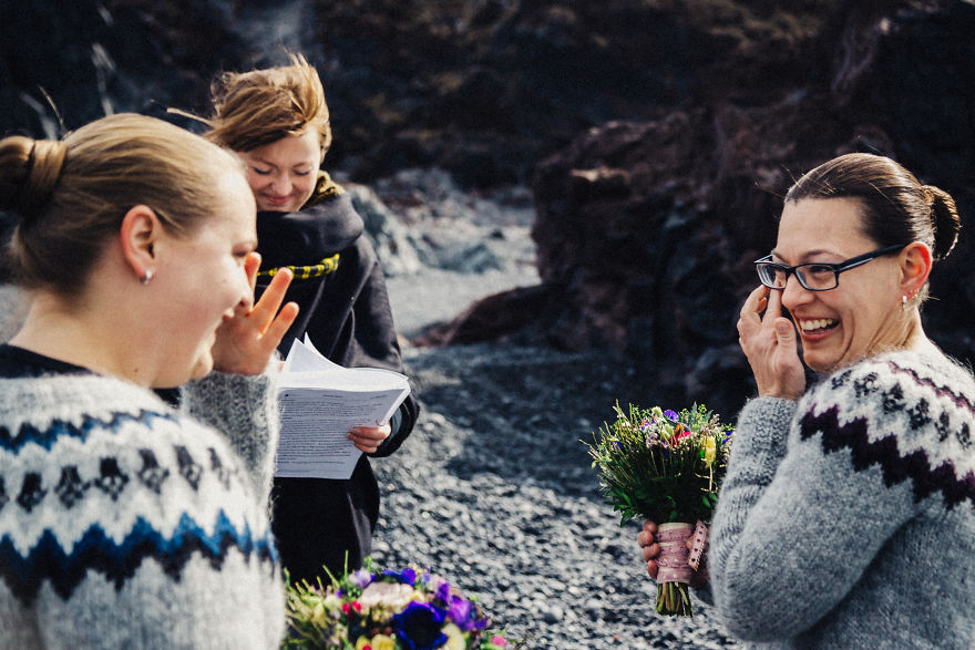 Two woman crying near a pastor 