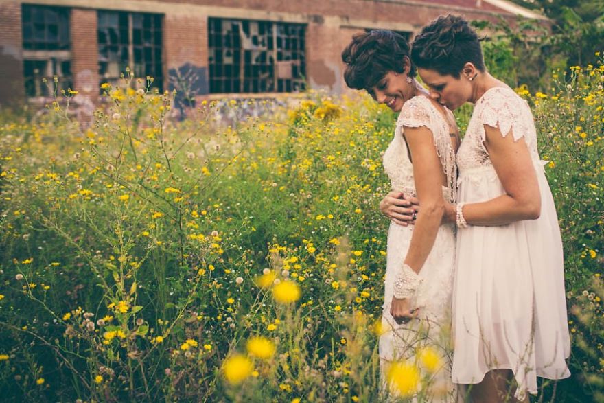 Two woman hugging in a meadow 