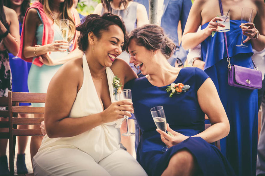 Two woman hugging and laughing 