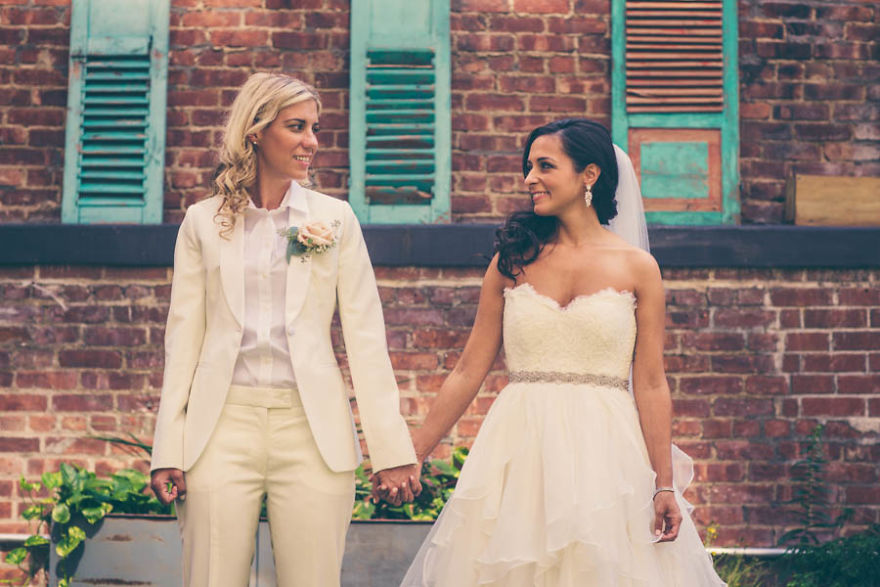 Two women holding hands 