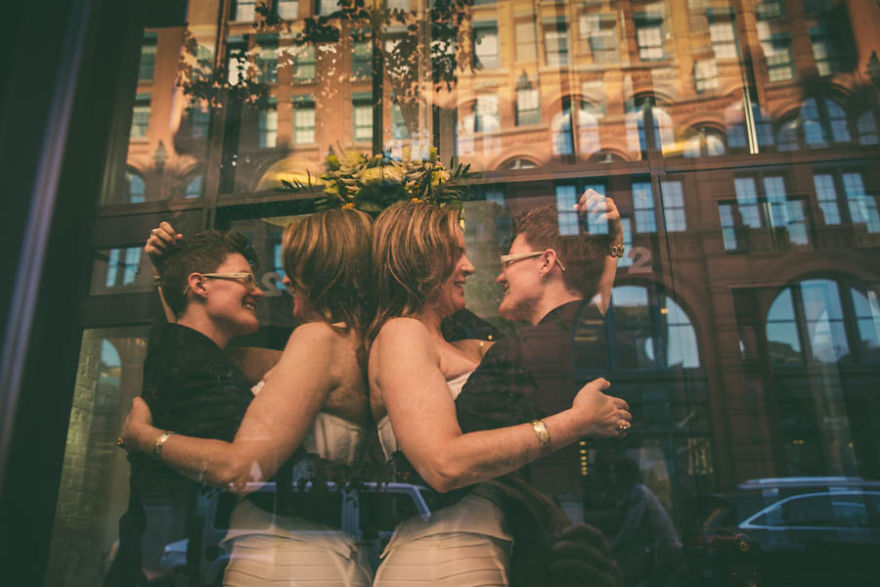 Two women hugging and looking at each other 