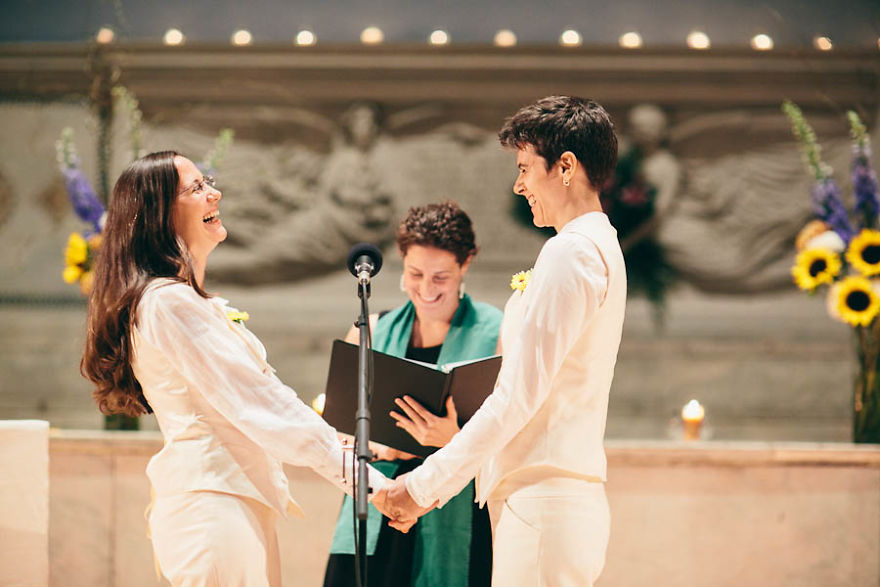 Two happy women looking at each other and laughing 