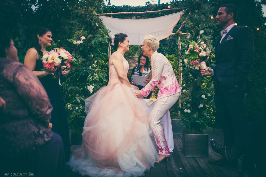 Two happy women standing near the altar 