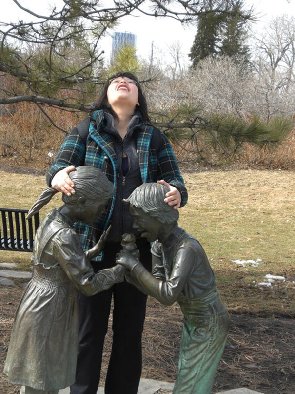 People Playing With Statues