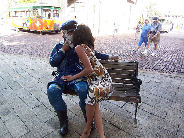 People Playing With Statues