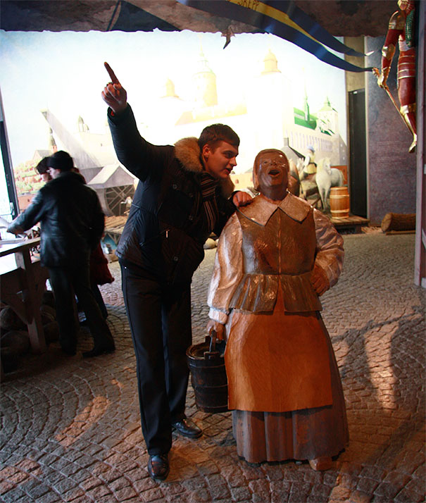 People Playing With Statues