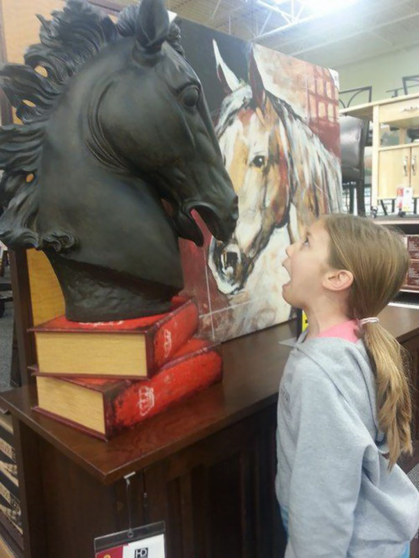 People Playing With Statues