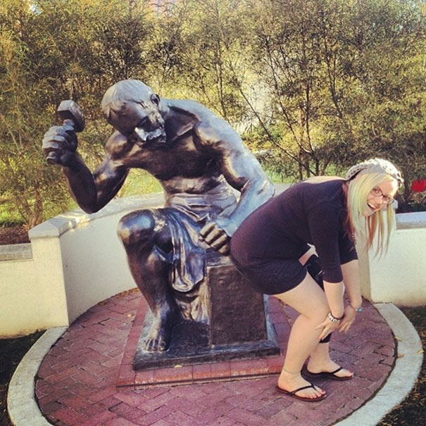 People Playing With Statue