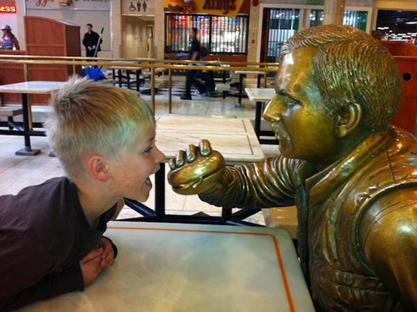 People Playing With Statues