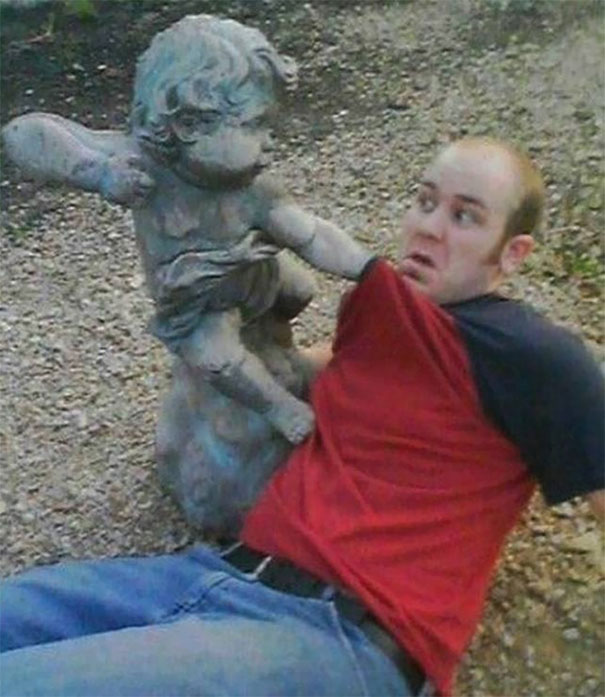 People Playing With Statues