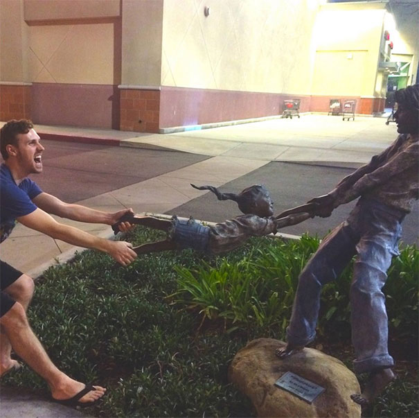 People Playing With Statues