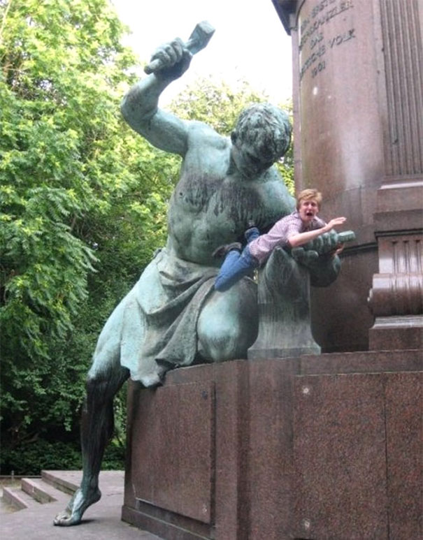 People Playing With Statues