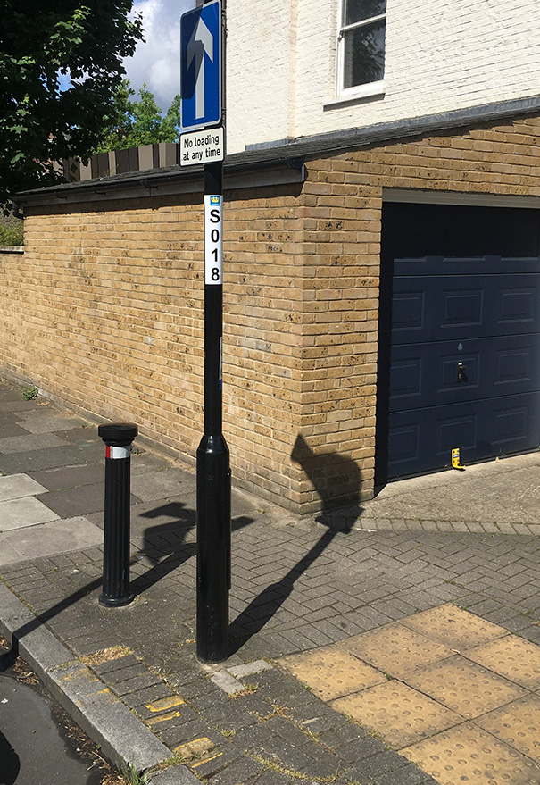 This Sign At The Right Angle Produced A Shadow Of A Cat