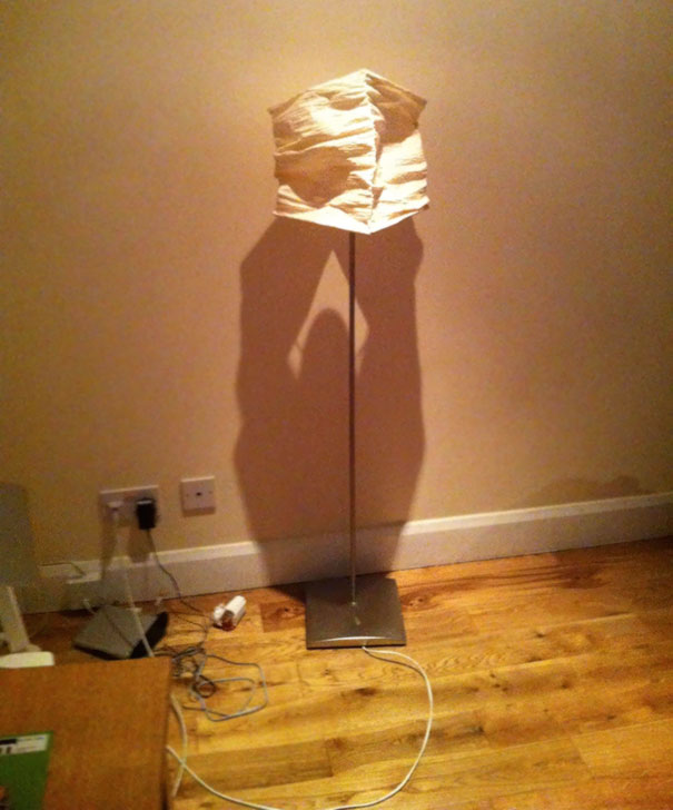 The Shadow Of This Lamp Makes It Look Like A Muscly Man With A Moustache Is Holding It Up