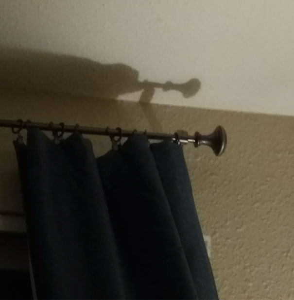 My Curtain Pole Shadow Looks Like A Lemur Playing A Trumpet