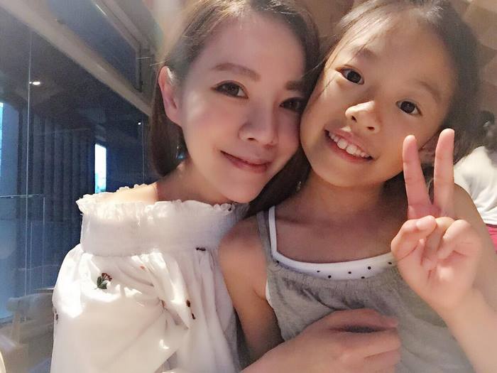 Woman and child smiling, showcasing age-defying beauty secrets with youthful appearance. Woman and child smiling, showcasing age-defying beauty secrets with youthful appearance.