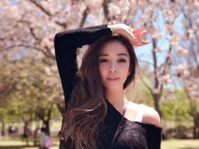 Youngest looking old person poses in a park, showcasing age-defying beauty techniques. Youngest looking old person poses in a park, showcasing age-defying beauty techniques.