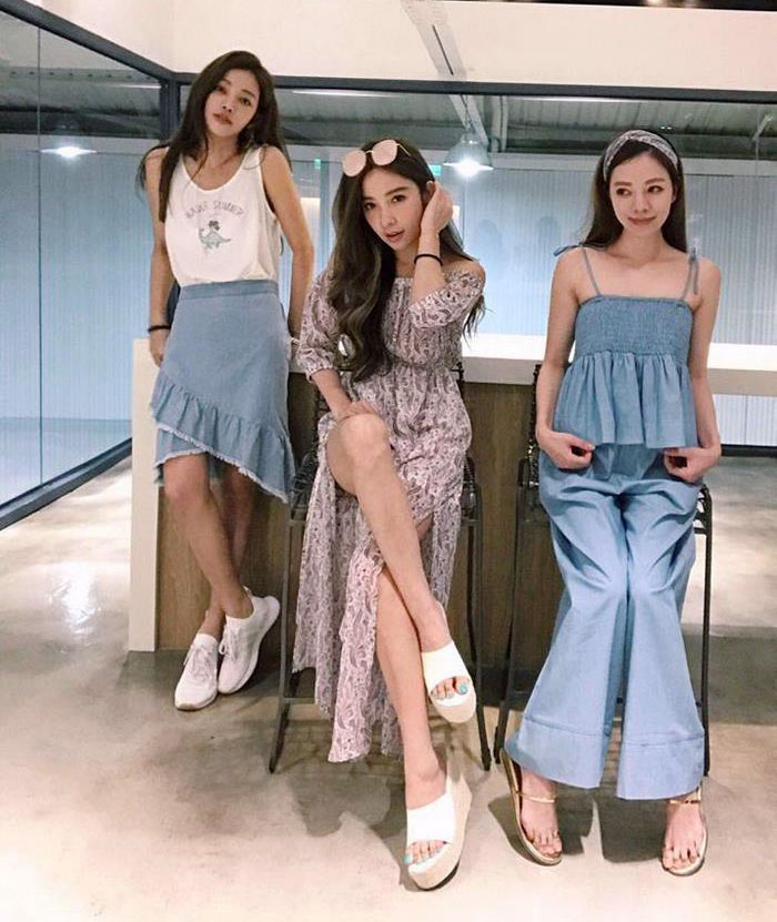 Three women showcasing youthful fashion, highlighting age-defying style. Three women showcasing youthful fashion, highlighting age-defying style.