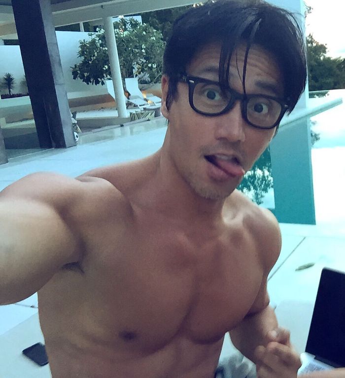 Chuando Tan taking a selfie shirtless by the swimming pool, showcasing a youthful and muscular body at 59 years old Chuando Tan taking a selfie shirtless by the swimming pool, showcasing a youthful and muscular body at 59 years old
