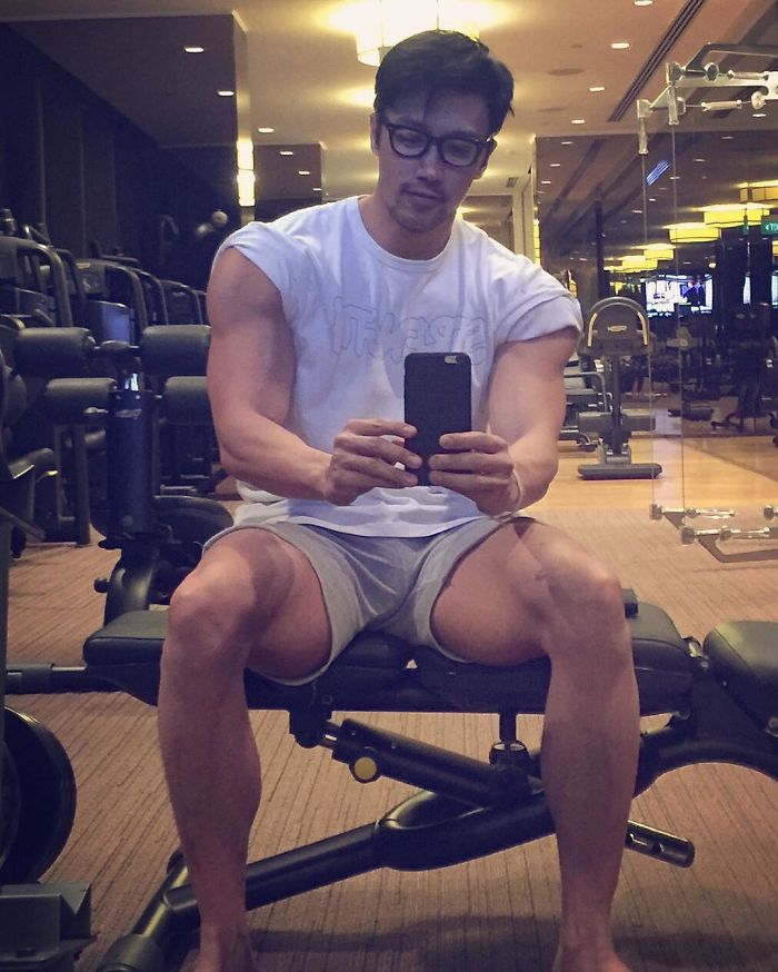 Chuando Tan taking a gym mirror selfie, showcasing the physique of a 20-year-old at age 59. Chuando Tan taking a gym mirror selfie, showcasing the physique of a 20-year-old at age 59.