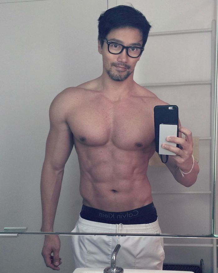 Chuando Tan taking a toeless mirror selfie showing a fit youthful body at age 59 with defined muscles and glasses. Chuando Tan taking a toeless mirror selfie showing a fit youthful body at age 59 with defined muscles and glasses.