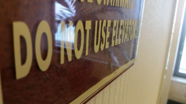 The Braille On This Hotel's Sign Is Under The Plexiglass