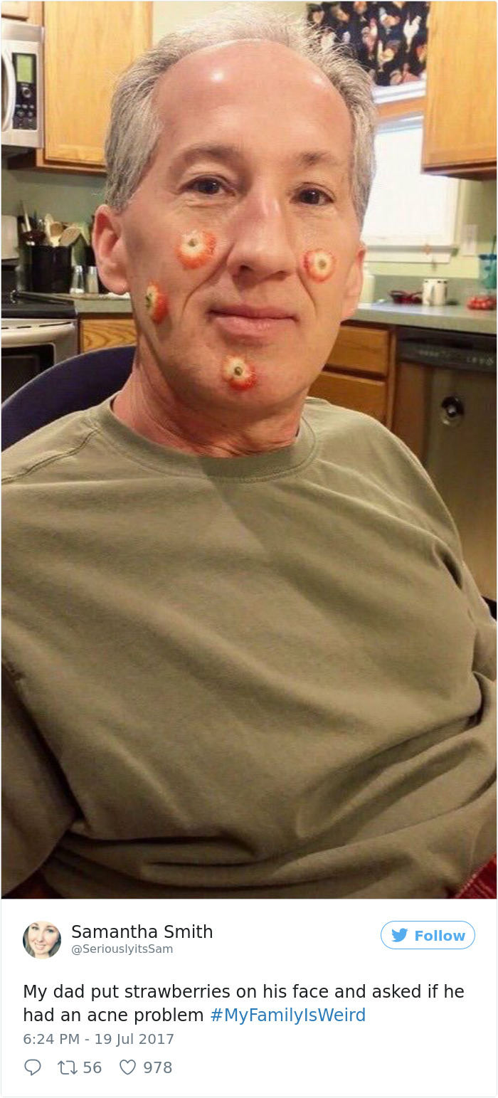 Dad with strawberries on his face joking about acne in the kitchen.