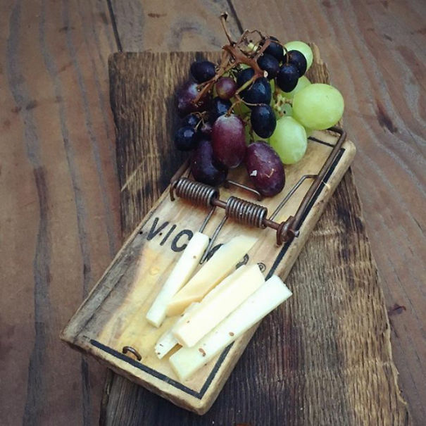 Half-Eaten Cheese And Grapes At Noa Restaurant