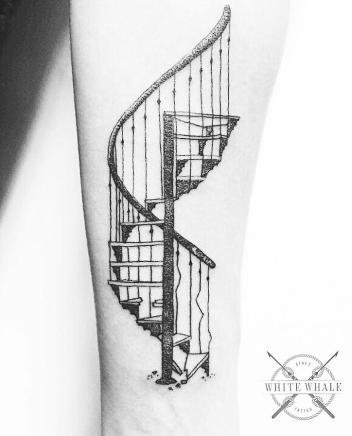 Tattoo of a detailed spiral staircase on arm, showcasing intricate architectural design.