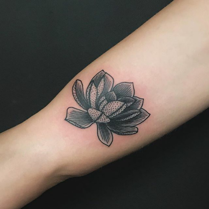 Succulent tattoo on forearm, showcasing detailed black and white design.