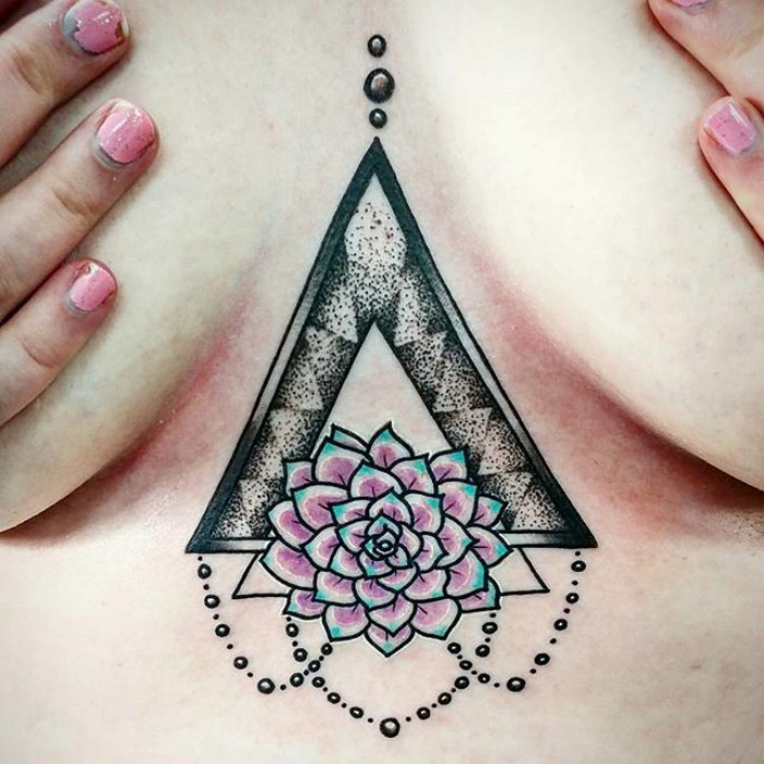 Geometric succulent tattoo featuring a pink rosette design with dotted accents.