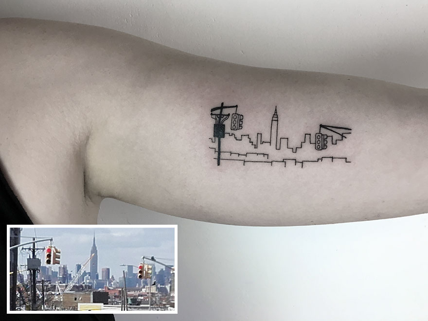 Tattoo of a city skyline on an arm, inspired by dedication to tattooing.