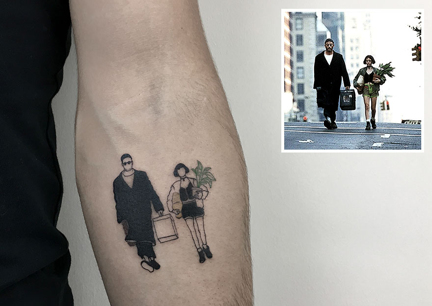 Tattoo of movie scene on arm, showcasing dedication to tattooing.