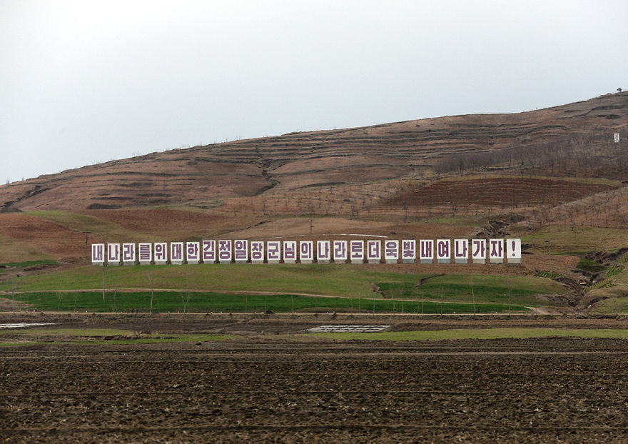 Lots Of Propaganda Billboards Can Be Seen From The Highway. A Big Investment Compared To The Transport...