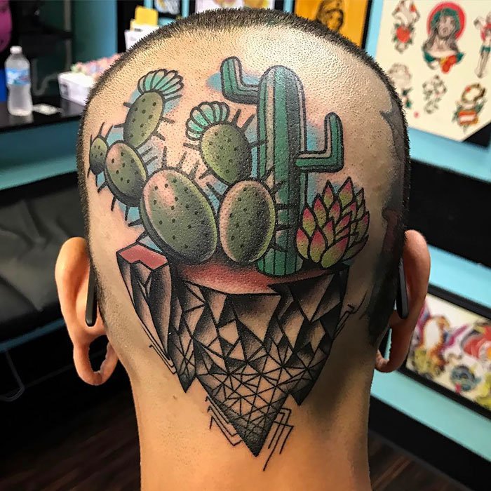 Head tattoo featuring colorful succulent design, including cacti and geometric patterns, ideal for succulent enthusiasts.