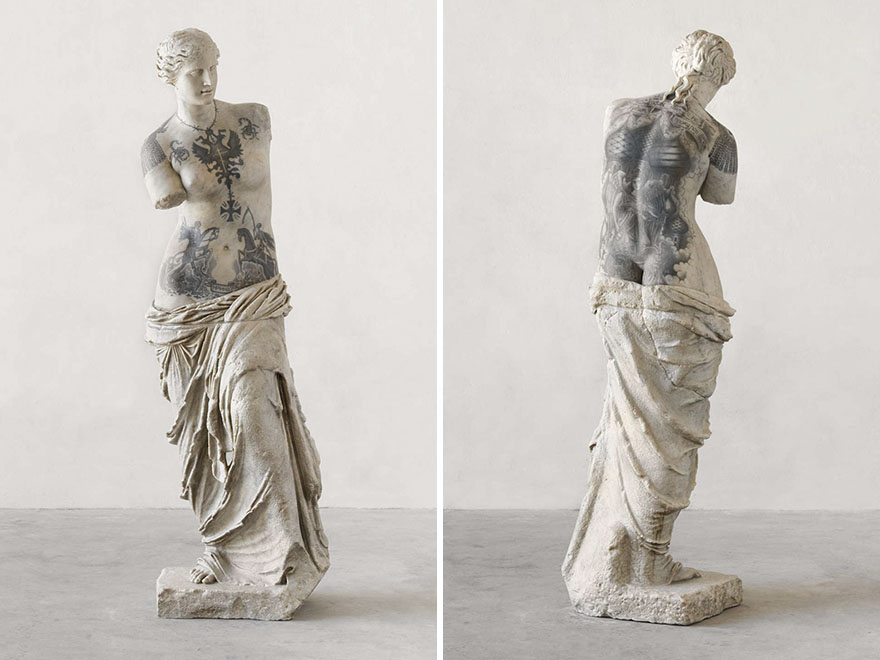 Classical sculpture with tattoos by Italian artist Fabio Viale, showcasing modern criminal ink designs. Classical sculpture with tattoos by Italian artist Fabio Viale, showcasing modern criminal ink designs.
