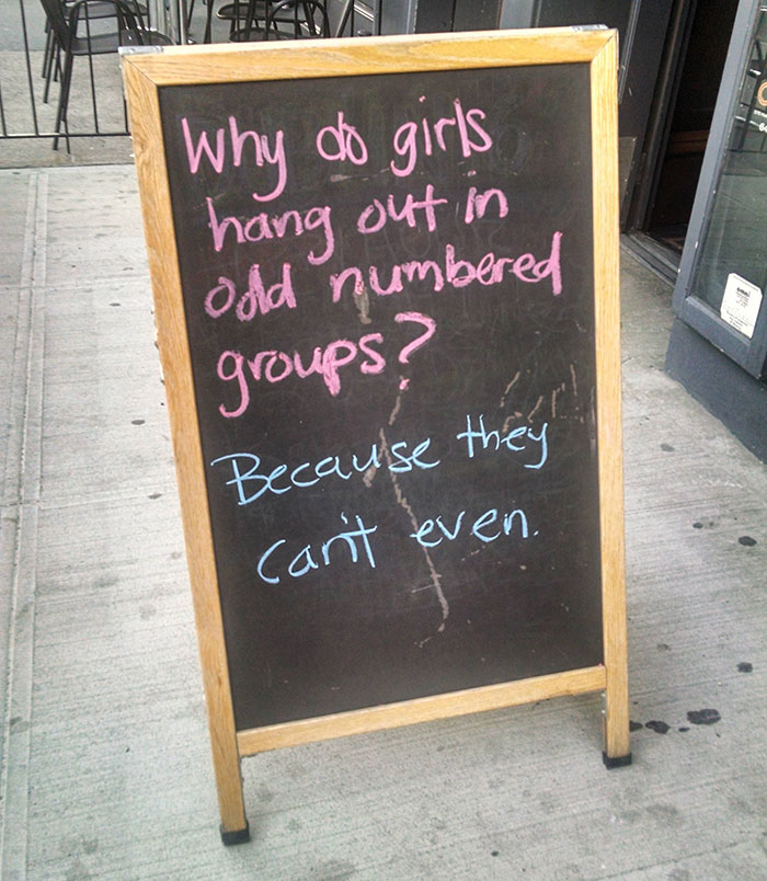 A Sign Outside Of A Bar