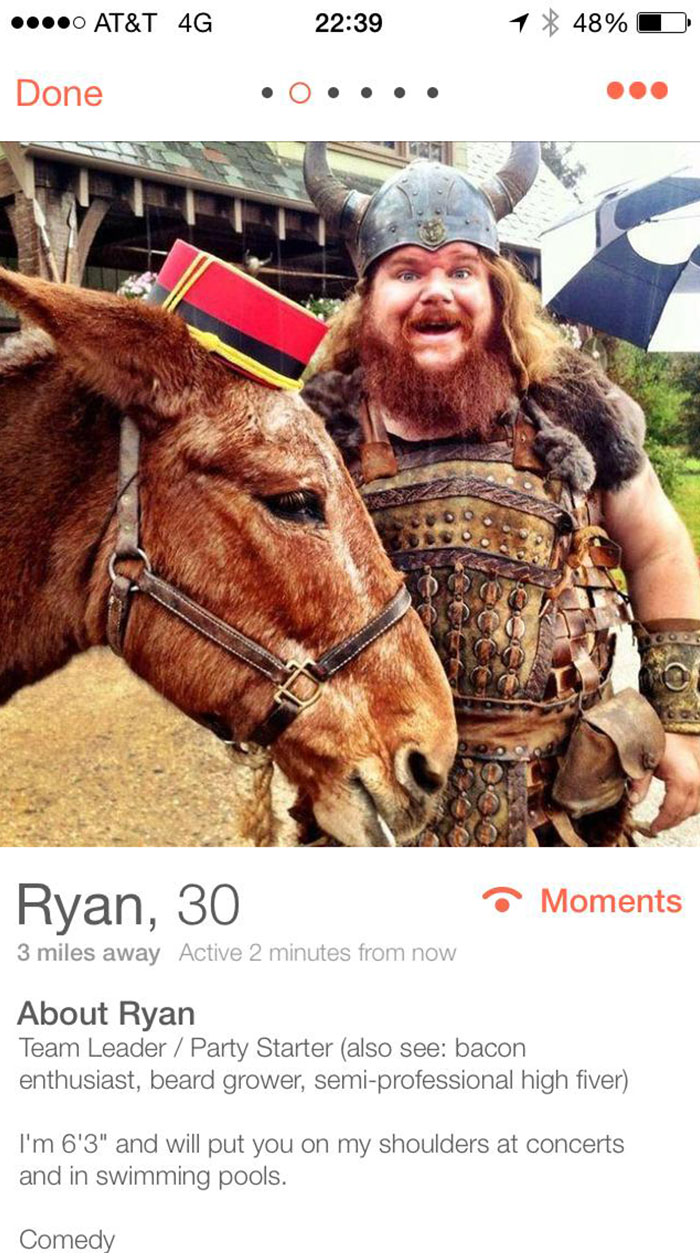 Bearded man in Viking costume with a donkey, showcasing a funny Tinder profile.
