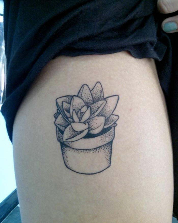 Succulent tattoo design featuring a potted plant on a person's skin.